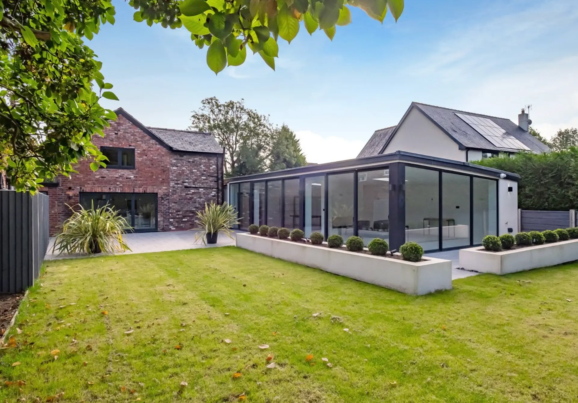 Ivy Cottage in Wilmslow, with its glass extension and garden